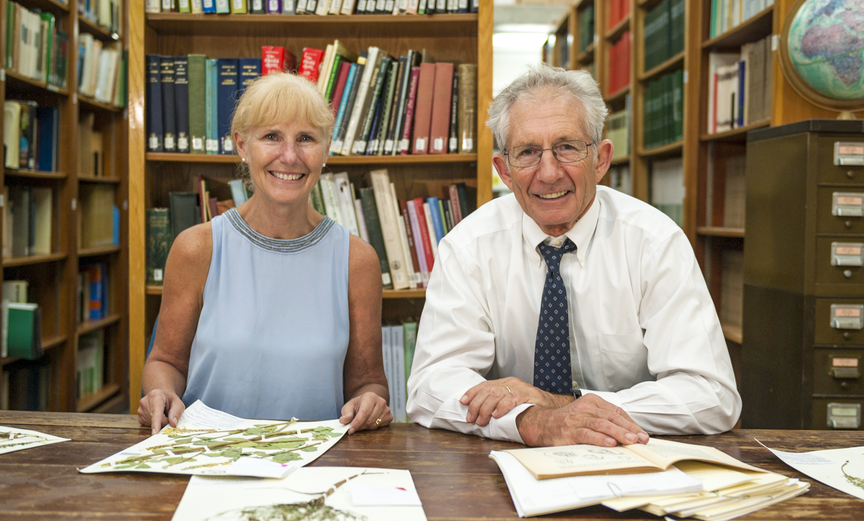 Pamela and Doug Soltis sit at a table.