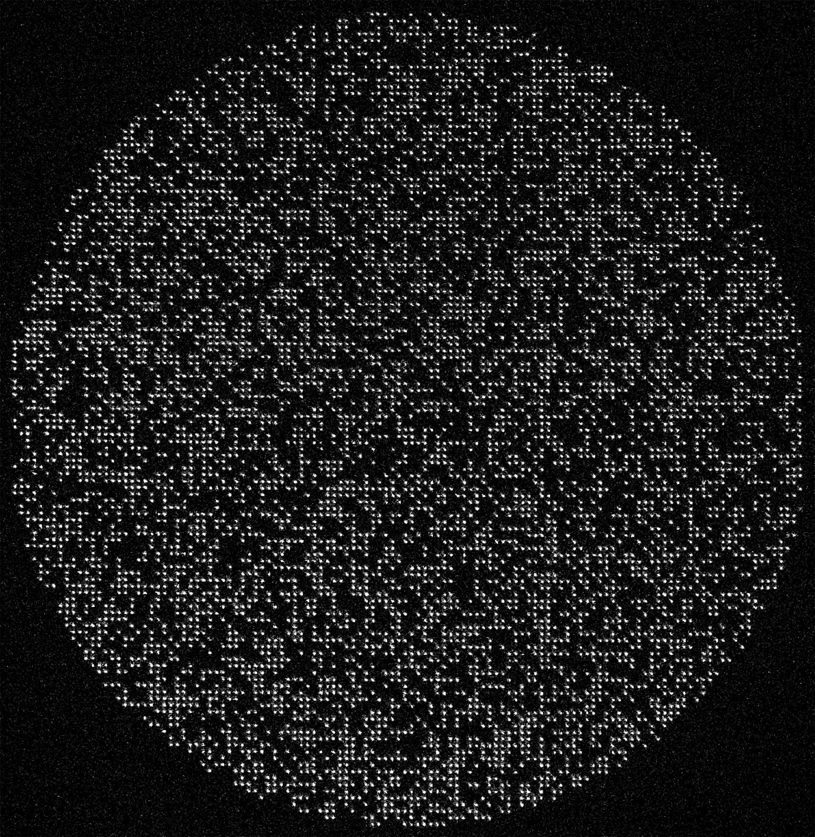 A circular grid of small white dots against a black background, showing 6,100 individually controlled cesium atoms in an optical tweezer array.